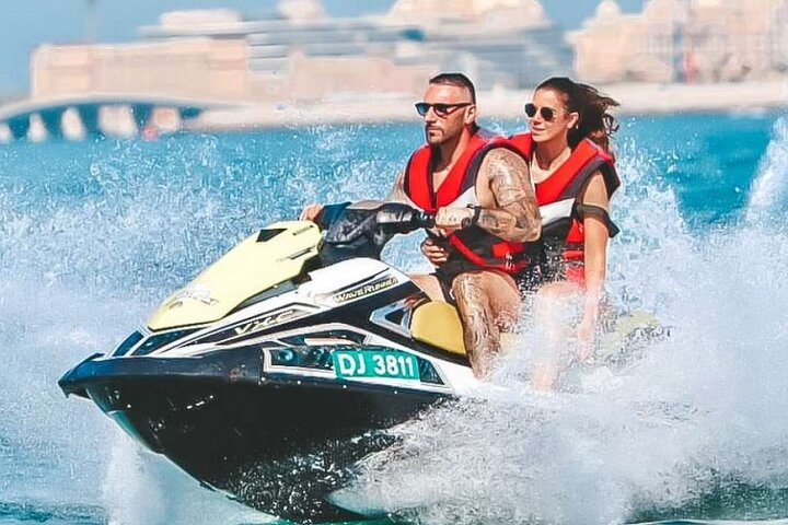 Experience the rush of jet skiing along Dubai's stunning coastline feeling the wind and sun as you glide past famous landmarks on the Arabian Gulf. Adventure awaits!